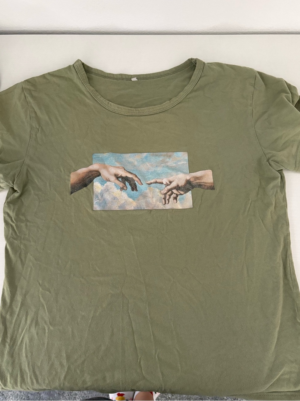 Olive Green Graphic Tee with Michelangelo-Inspired Hands